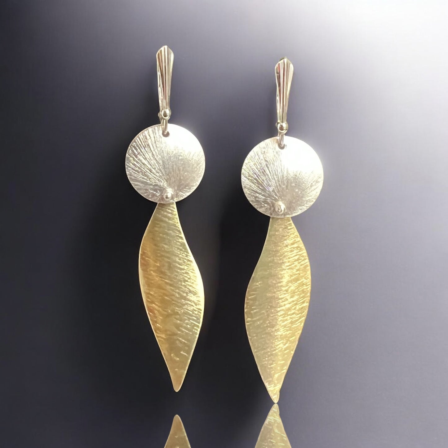 Bold, lightweight leaf and circle geometric design gold and silver dangles