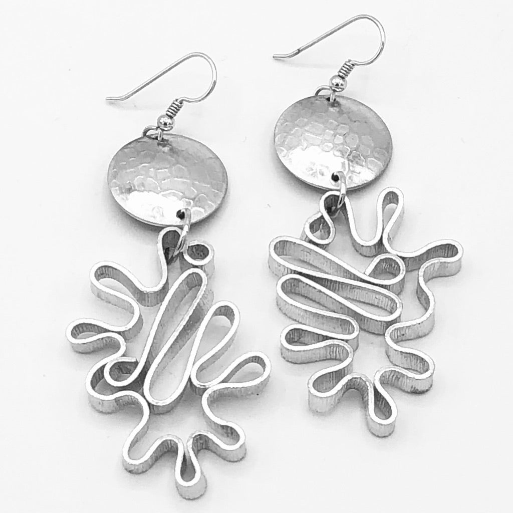 Modern flower earrings. Contemporary and lightweight statement earrings in silver. Unique and fun to wear!
