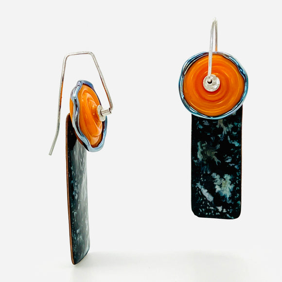 Marbled black and white dangles are accented with orange lamp work glass.  Sterling silver ear wires.