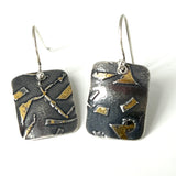 Deeply oxidized sterling silver and 24K gold combine in these small rectangle shape dangle earrings...modern, one of a kind.