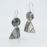 Dimensional geometric shapes combine together to resemble sailboats, angels or perhaps just the fun shapes they are of a circle and "4 sided" triangle. Great acid etched textures and movement with the two components dangling independently of each other.  "Score and bend" technique gives these earrings their 3 dimensional quality. These earrings measure 1 3/4" in length and 3/4" in width.