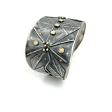 Bold statement cuff bracelet with an Art Deco Vibe!   24K gold accents on deeply textured cuff bracelet commands attention!