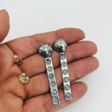 Polka dot long dangle post earrings.