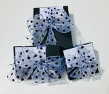 Polka dot long dangle post earrings.