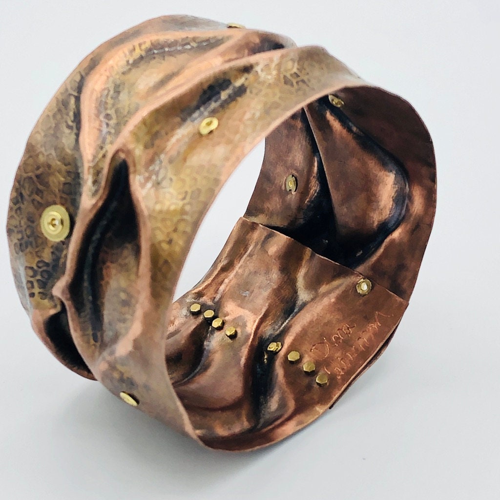 Riveting and curvy unique handmade fold formed copper bangle