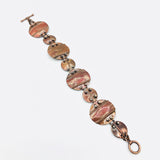 Interconnecting circles create this beautiful copper & sterling bracelet.  Modern, with an architectural vibe.
