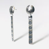 Polka dot long dangle post earrings.