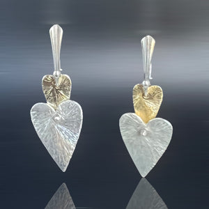 Delicate two-tier heart shape dangles in gold and silver