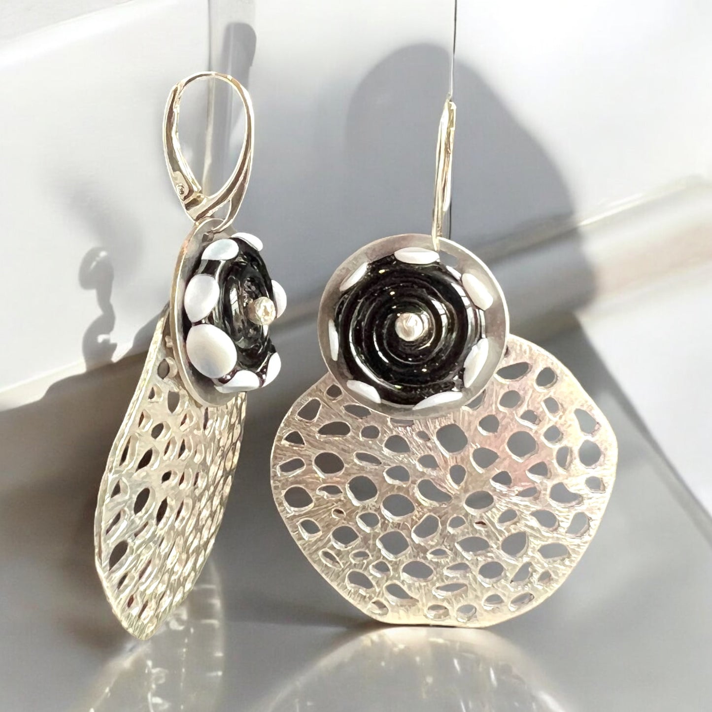 Gotta love dots!  Modern and fun black, white and silver dangles