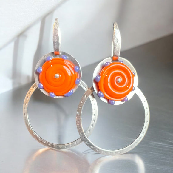 Kinetic orange and purple hoop dangles in steel, sterling silver