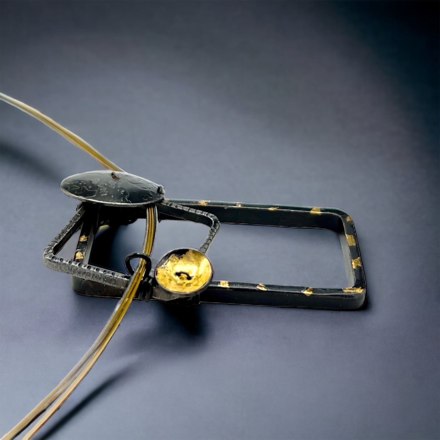 Bold and geometric....steel necklace with 24K gold