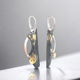 "Golden Asteroid 2"....steel, sterling, 22K and 24K gold dangle earrings