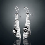 "It's a Jungle Out There"....contemporary steel, fine silver dangles