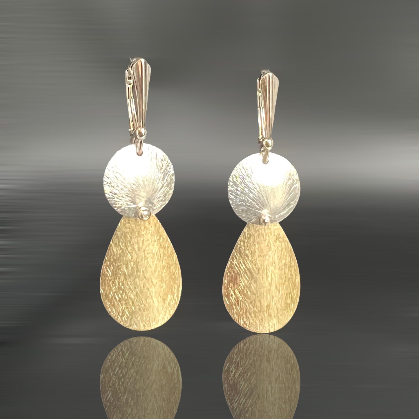Teardrop and circle beautifully textured and riveted gold and silver dangle earrings