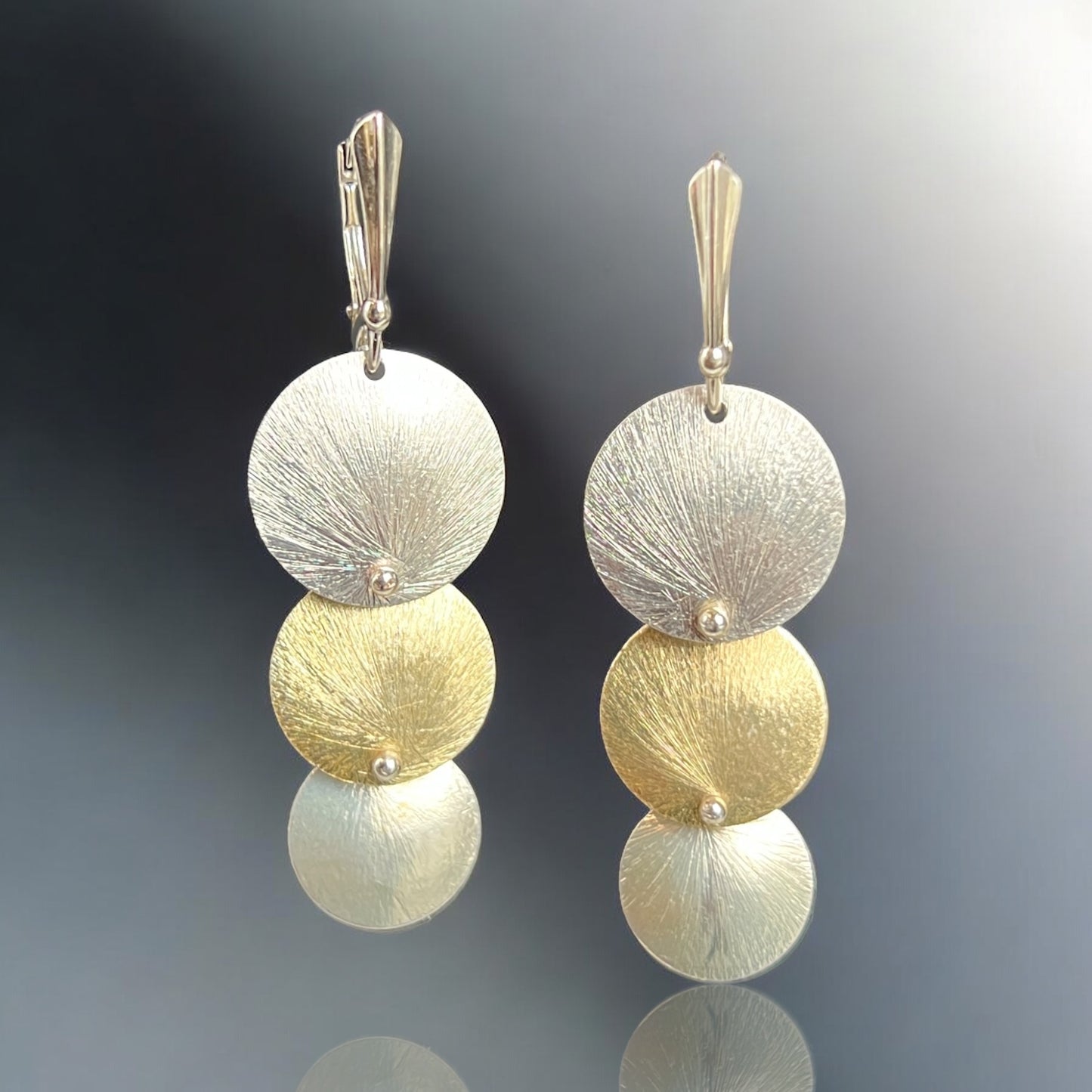 Graduated 3 circle gold and silver kinetic dangle earrings