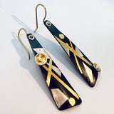 Black, gold and silver dangle earrings in steel and 24K gold