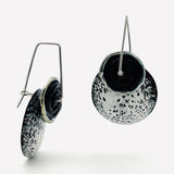 Black and white speckled design enamel earrings with black lamp work glass bead, sterling silver ear wires.