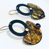 Black and gold steel earrings in geometric shapes