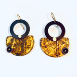 Black and gold steel earrings in geometric shapes