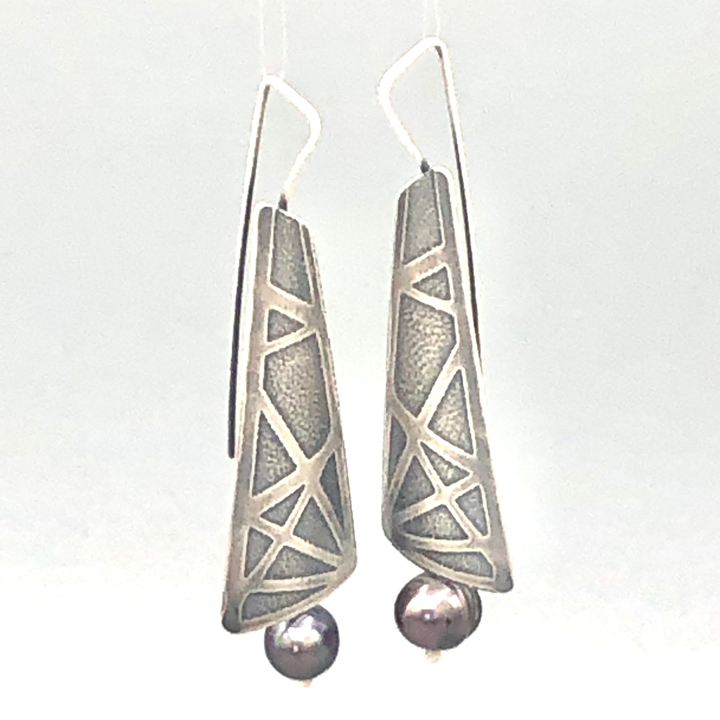 Sterling silver pearl dangle earrings.