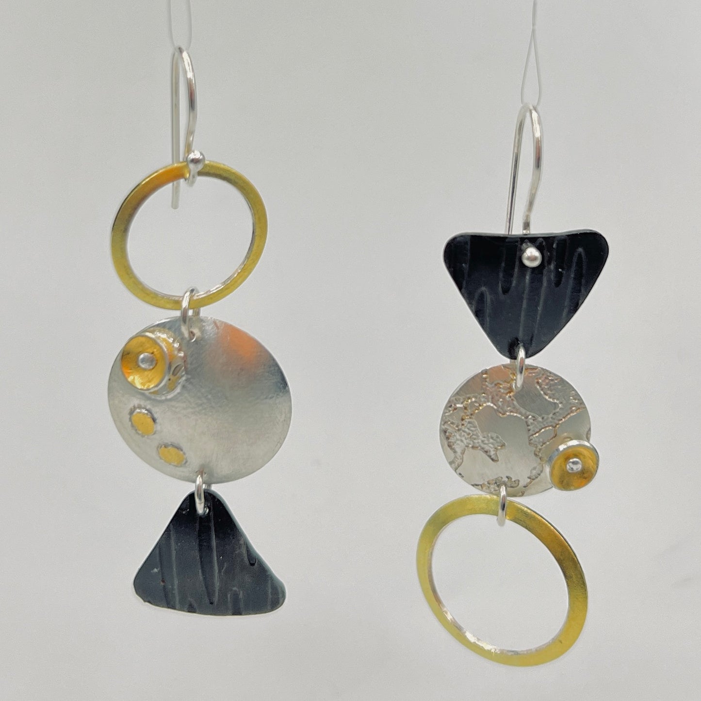 "Asymmetrical Geometry"....steel, 24K gold, sterling silver dangles