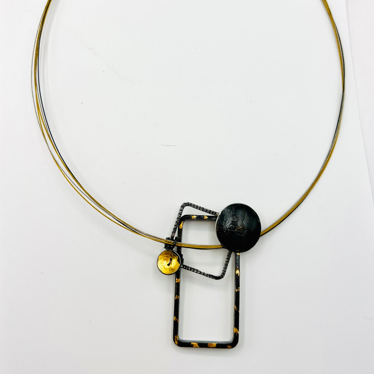 Bold and geometric....steel necklace with 24K gold