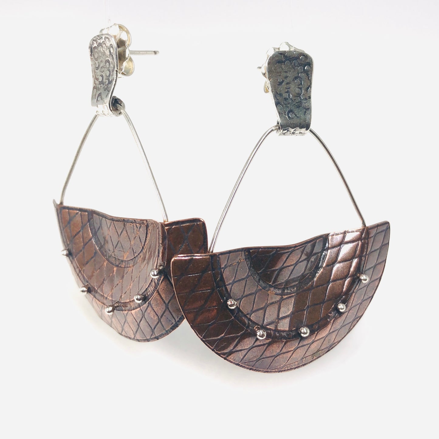 Modern & geometric copper earrings have incredible texture and dimension!