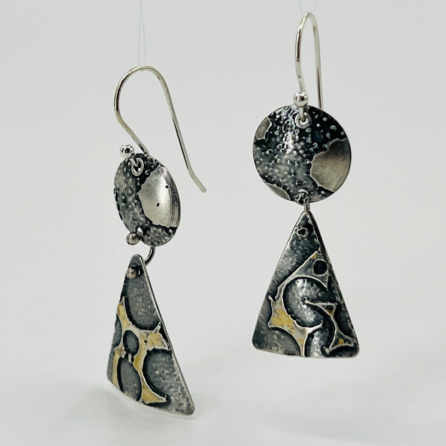 Deeply oxidized sterling silver and subtle touches of 24K gold combine in these 2 part dangle earring design