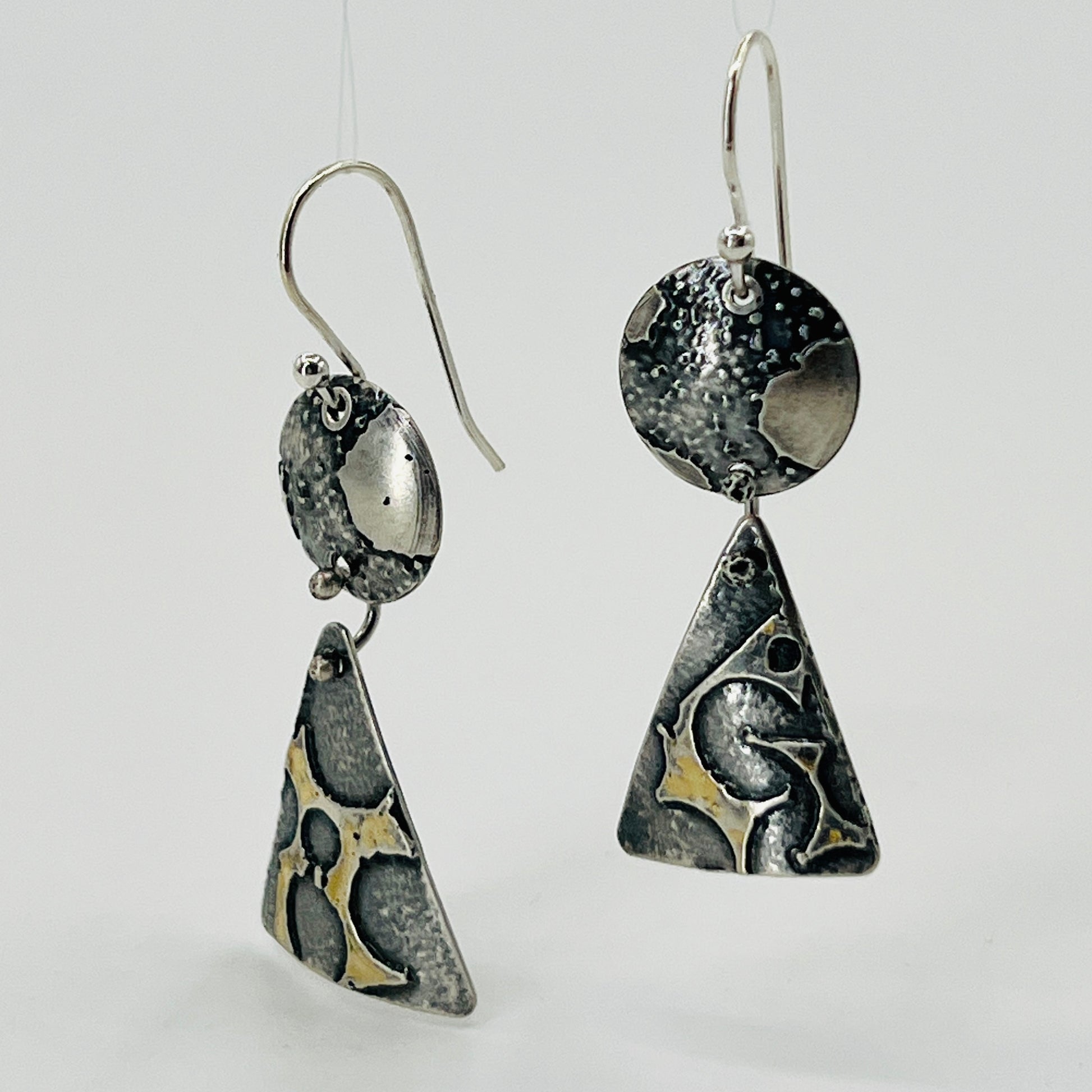Deeply oxidized sterling silver and subtle touches of 24K gold combine in these 2 part dangle earring design