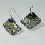 Deeply oxidized sterling silver and 24K gold combine in these square shape dangle earrings hung on diagonal