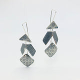 Sterling silver contemporary dangle earrings.