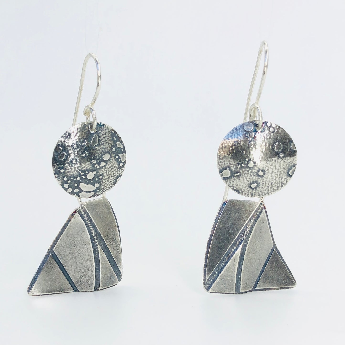 Sterling silver "angel" dangle earrings.