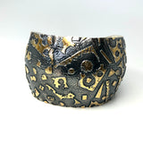 24K gold accents on deeply textured sterling silver cuff