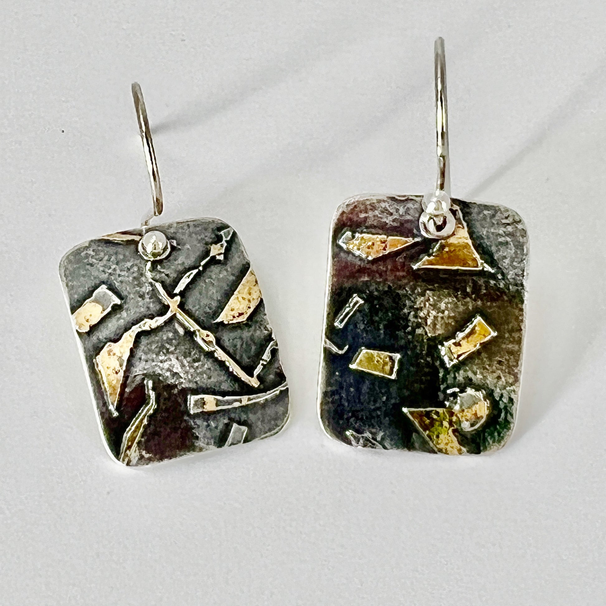 Deeply oxidized sterling silver and 24K gold combine in these small rectangle shape dangle earrings...modern, one of a kind. 