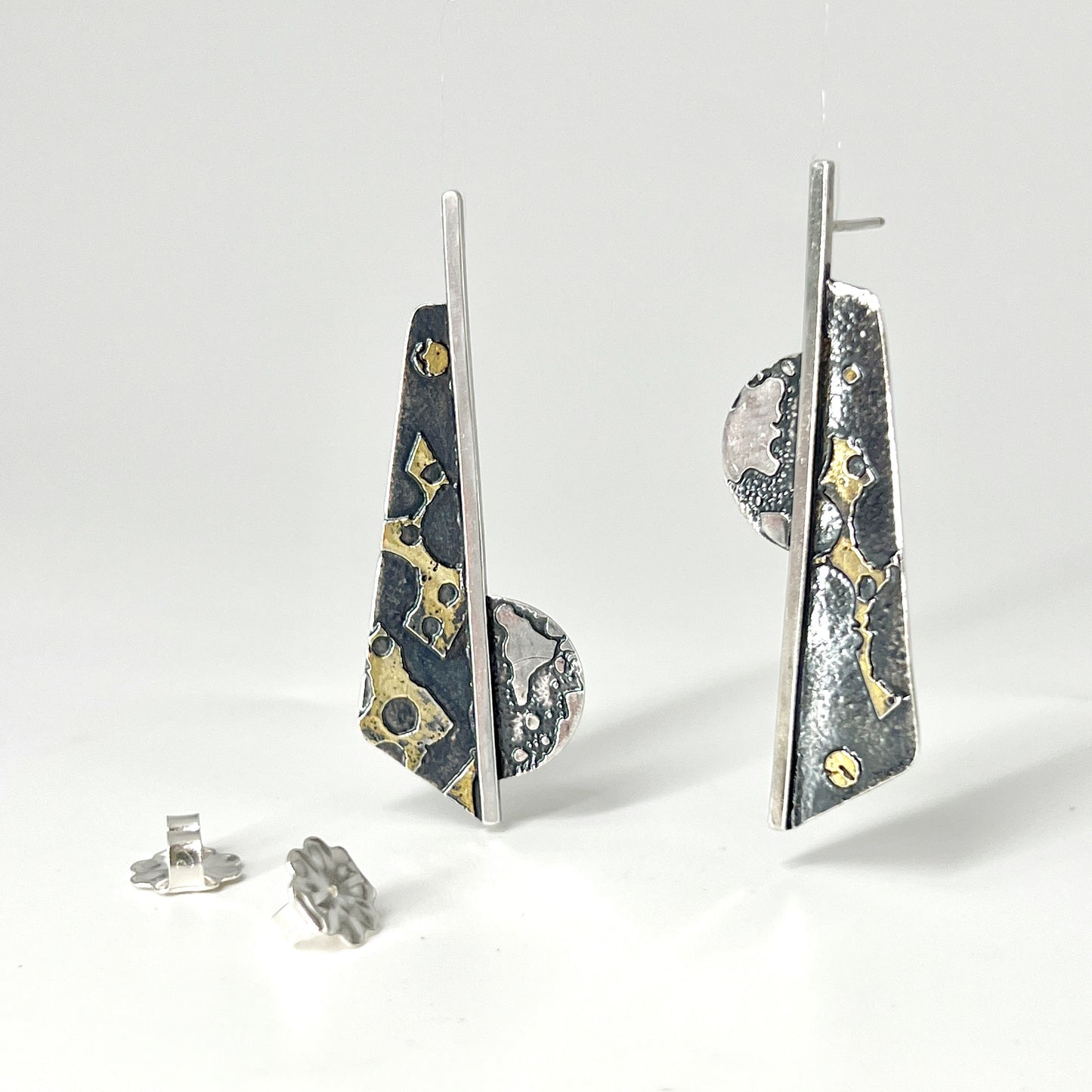 Handmade, one of a kind bold, contemporary geometric post earrings are stunning! Oxidized sterling silver and 24k gold.