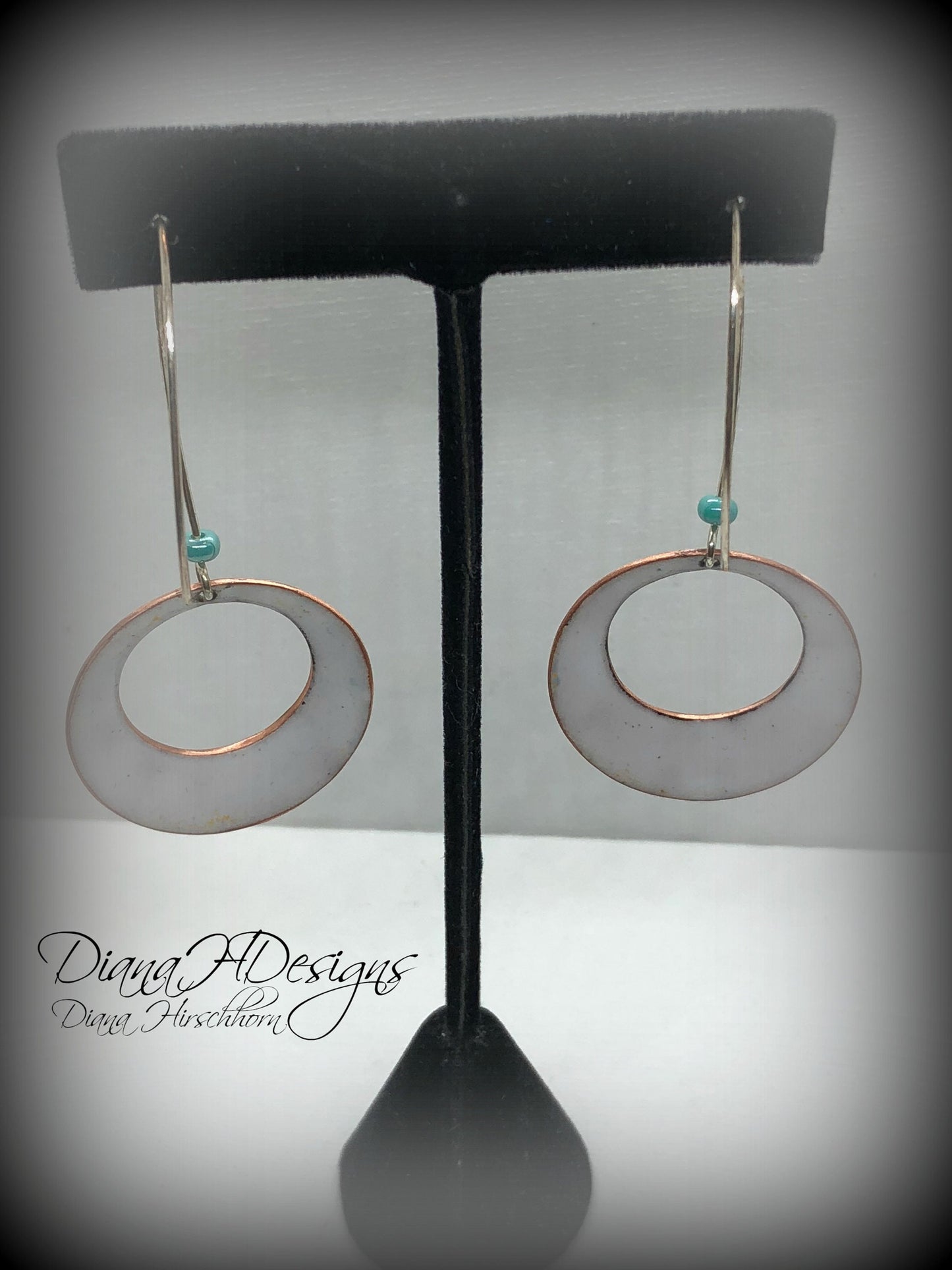 Geometric open hoop earrings are retro as well as modern.  Yellow, blue, green vitreous enamel.