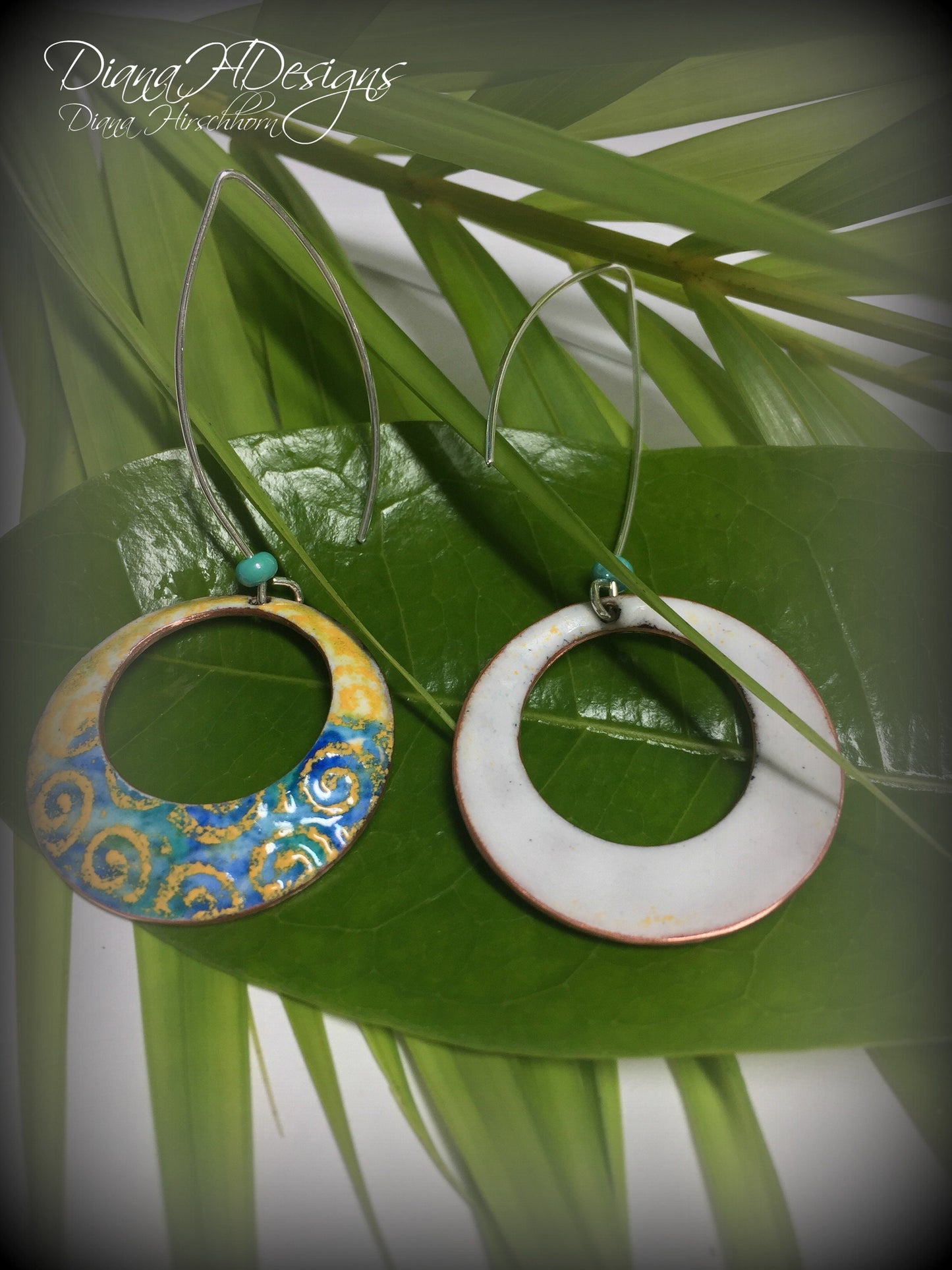 Geometric open hoop earrings are retro as well as modern.  Yellow, blue, green vitreous enamel.