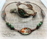 Copper and shell choker necklace.  Comfortable to wear, adjusts easily.  Green and bronze tones.