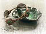 Copper and shell choker necklace.  Comfortable to wear, adjusts easily.  Green and bronze tones.