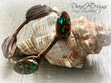 Copper and shell choker necklace.  Comfortable to wear, adjusts easily.  Green and bronze tones.