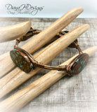 Copper and shell choker necklace.  Comfortable to wear, adjusts easily.  Green and bronze tones.