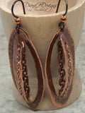 Incredibly unique copper earrings boast stitched detailing with chain.  Niobium ear wires