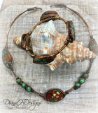 Copper and shell choker necklace.  Comfortable to wear, adjusts easily.  Green and bronze tones.