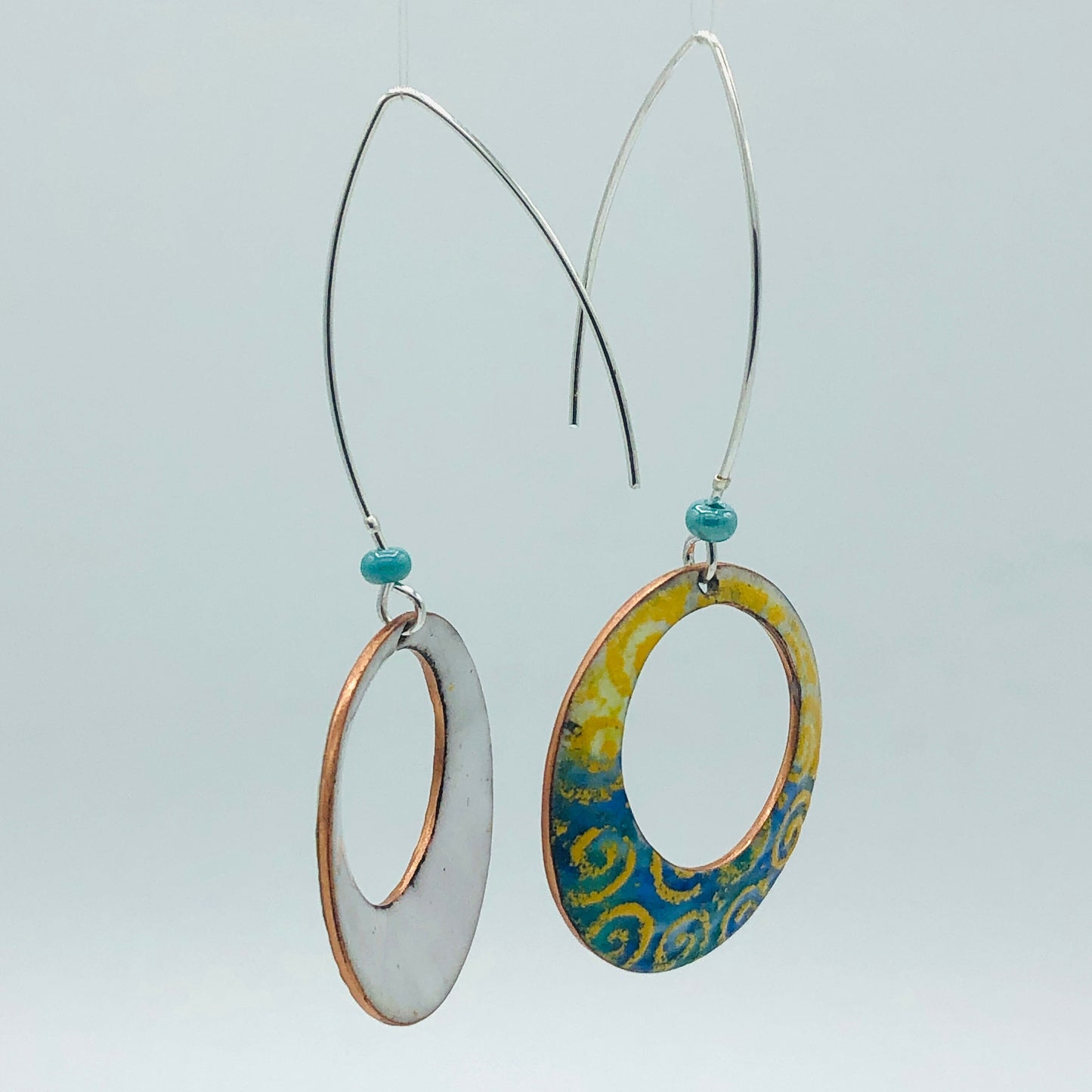 Geometric open hoop earrings are retro as well as modern.  Yellow, blue, green vitreous enamel.