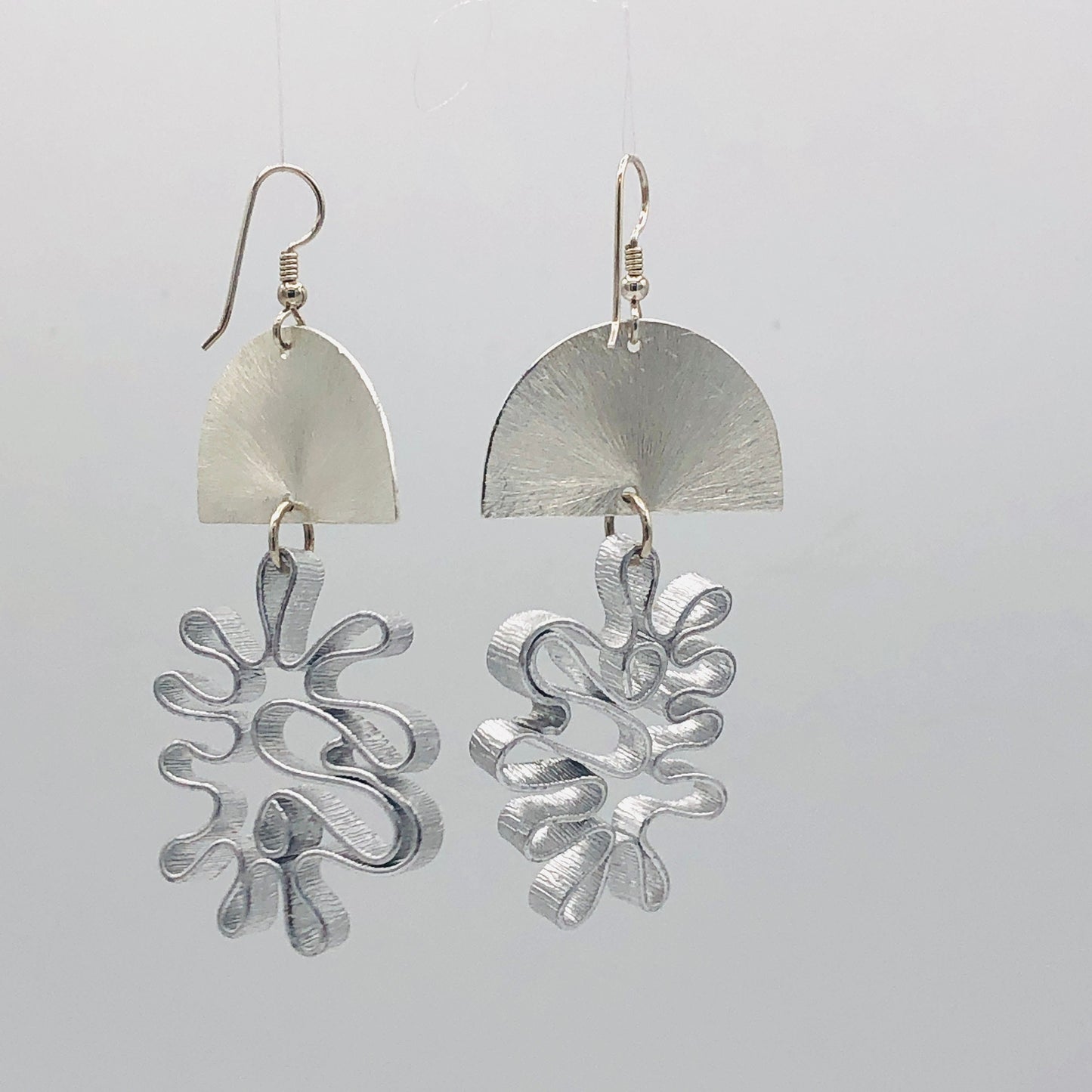 Bold flower silver aluminum statement earrings