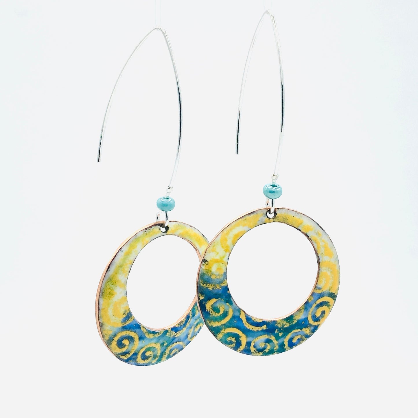 Geometric open hoop earrings are retro as well as modern.  Yellow, blue, green vitreous enamel.