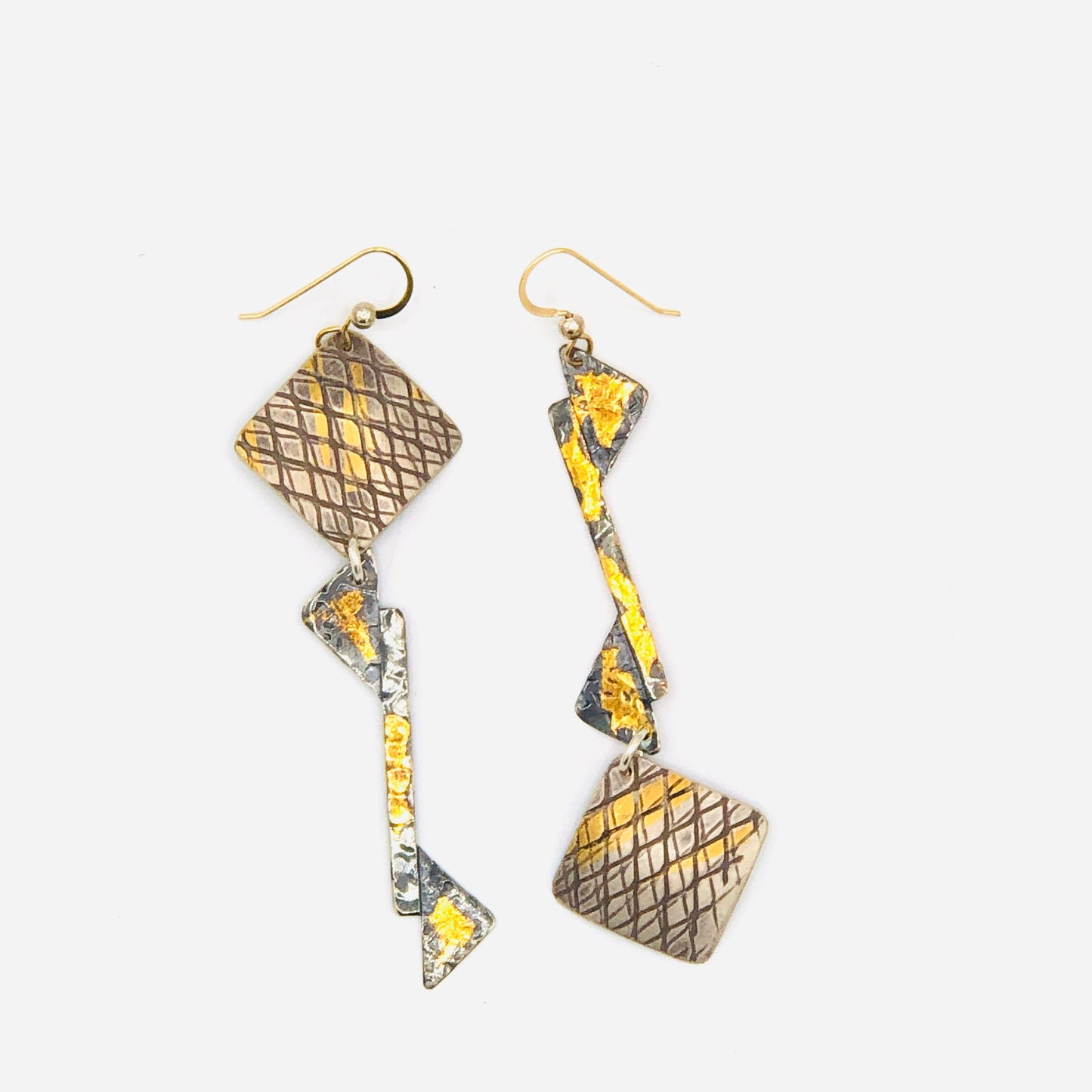 Asymmetrical earrings 24K gold on sterling silver in an industrial/architectural design!
