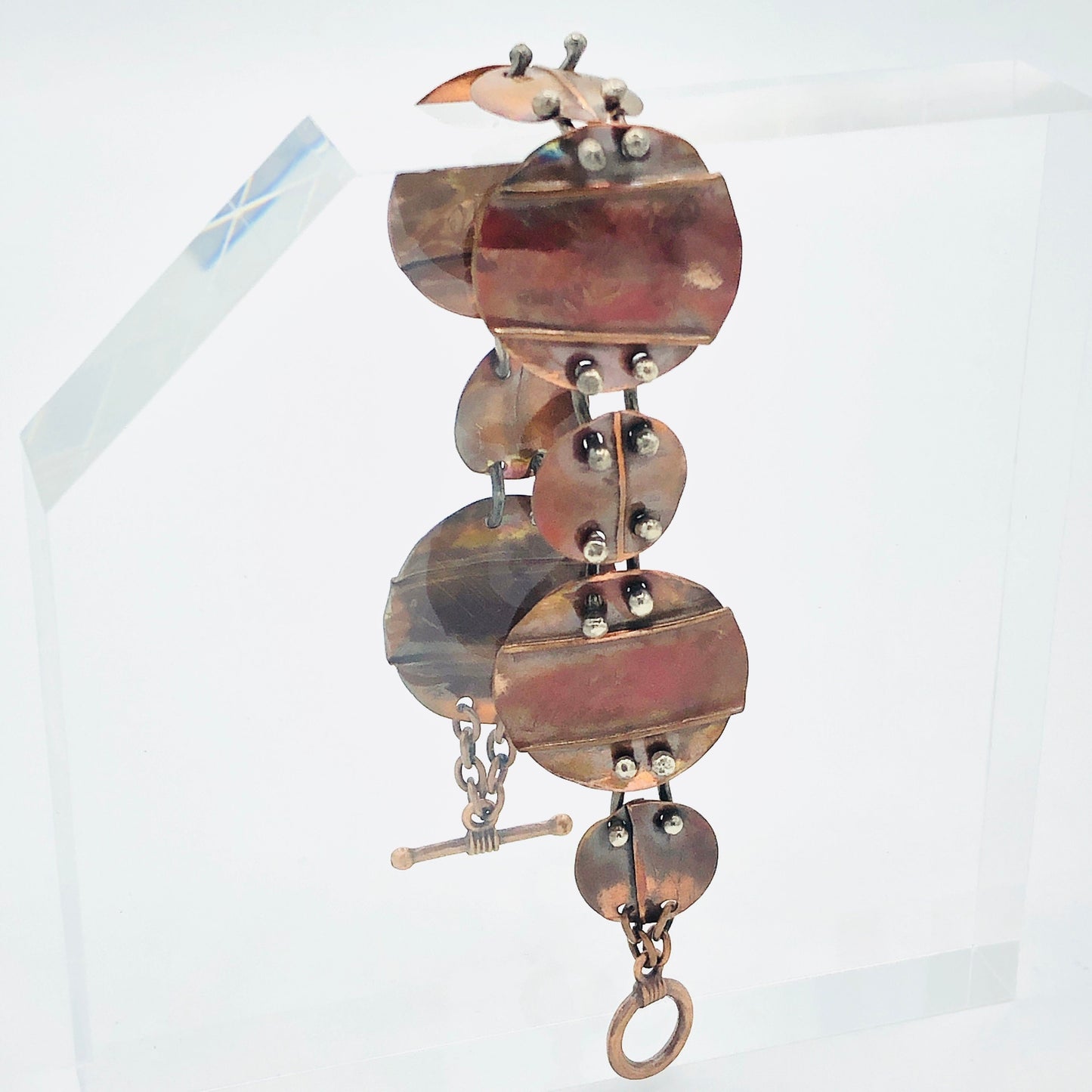 Interconnecting circles create this beautiful copper & sterling bracelet.  Modern, with an architectural vibe.