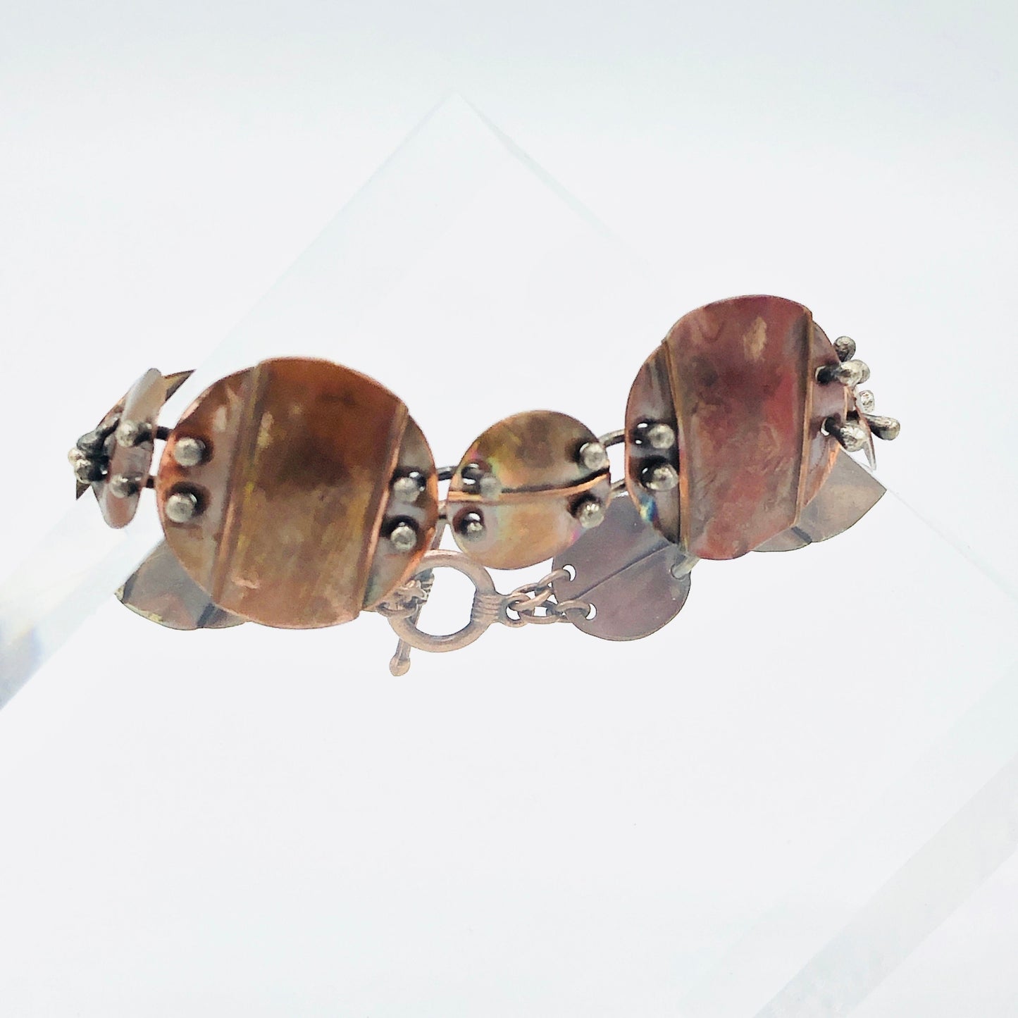 Interconnecting circles create this beautiful copper & sterling bracelet.  Modern, with an architectural vibe.