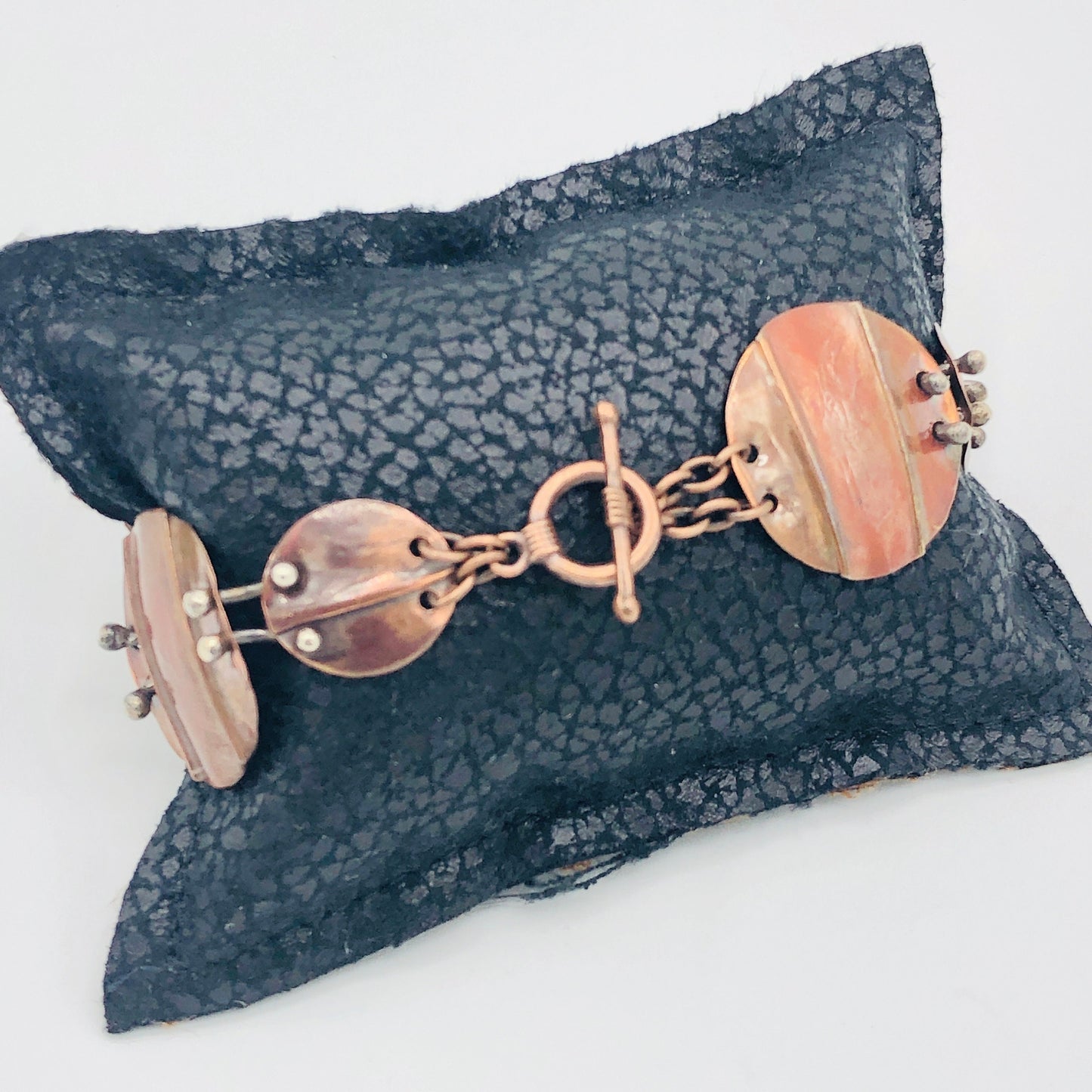 Interconnecting circles create this beautiful copper & sterling bracelet.  Modern, with an architectural vibe.